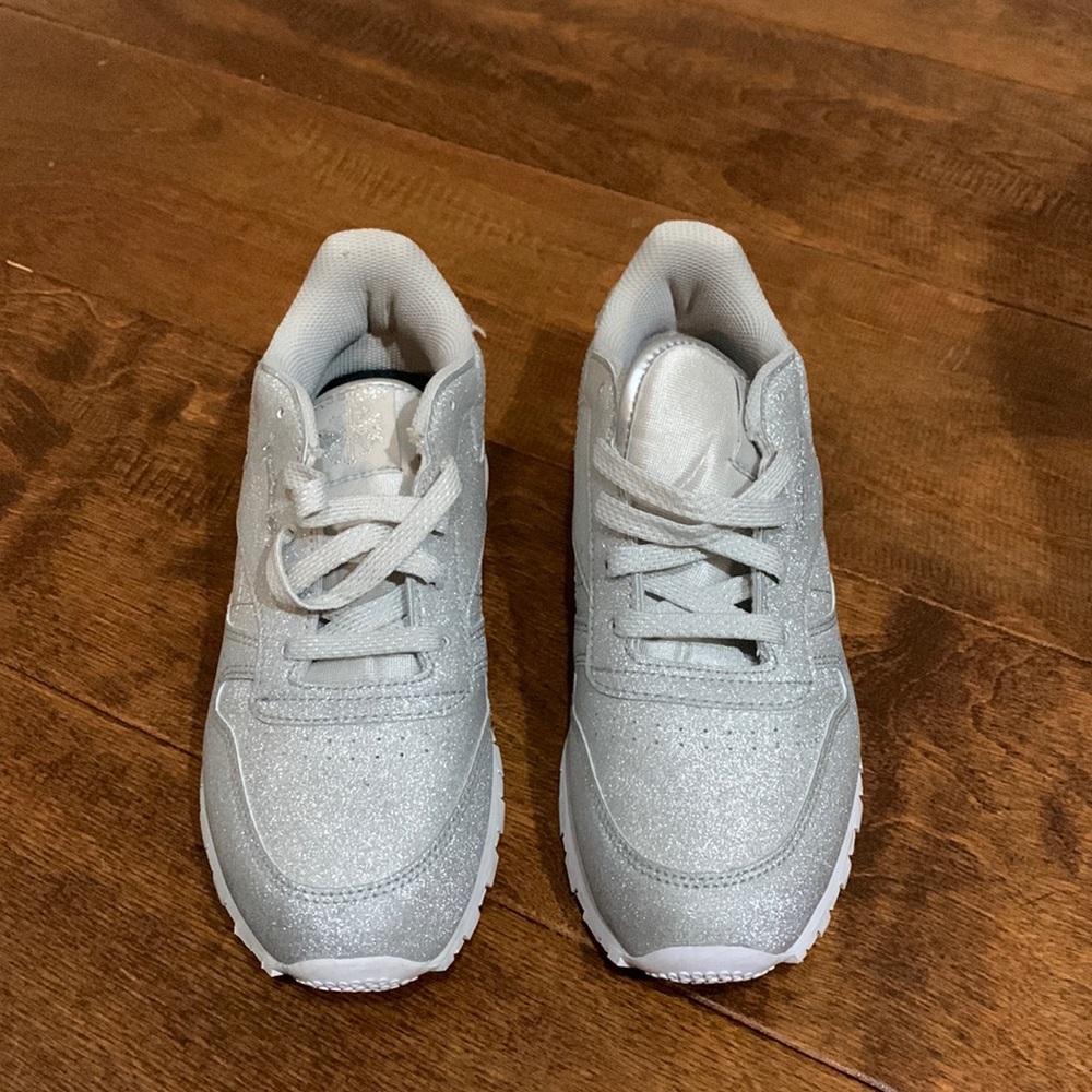Girl’s silver Reebok Ortholite